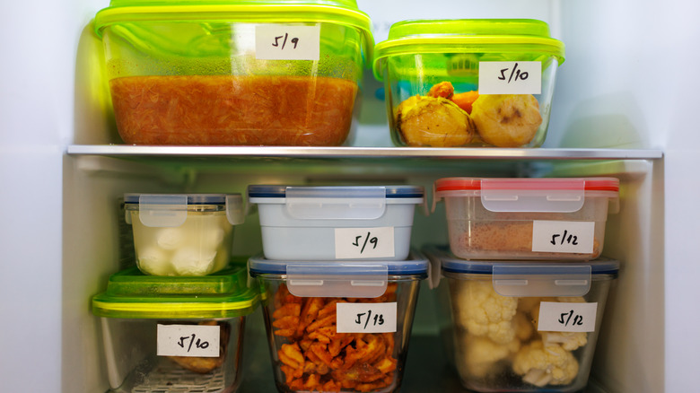 clear containers on refrigerator shelves with date labels