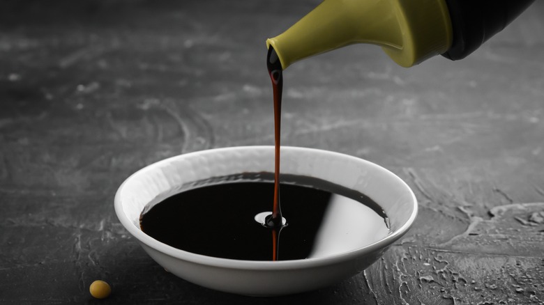 soy sauce poured from a bottle