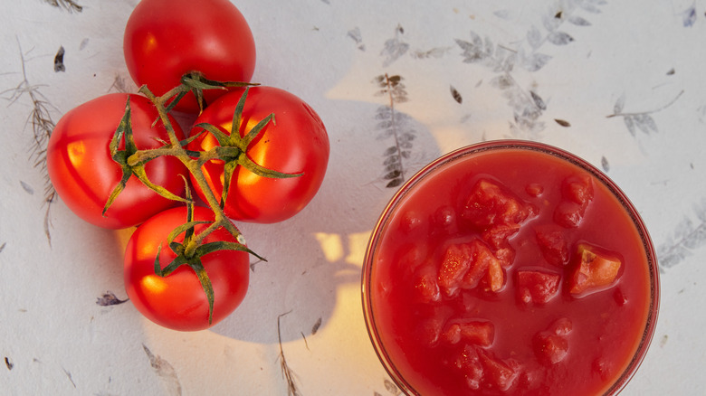 Fresh tomatoes and bowl of dice tomatoes