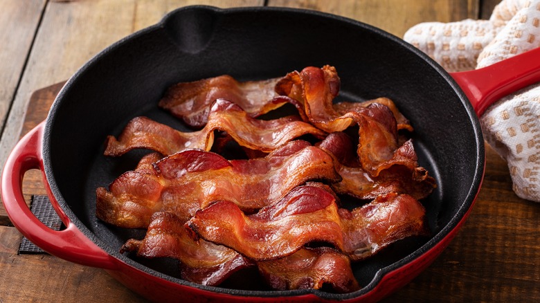 strips of bacon in a cast iron pan