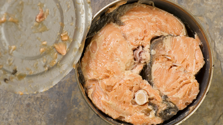 Overhead view of opened can of salmon