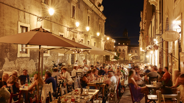 People dining outdoors at night