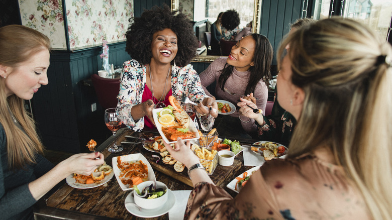 Group of women sharing food in restuarant