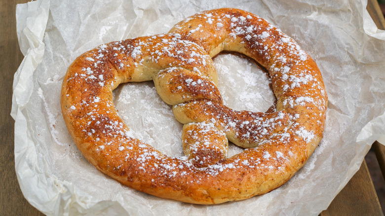 Cinnamon sugar soft pretzel on paper wrapper