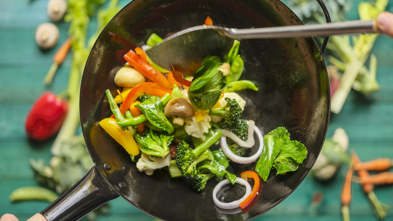 veggies sautéing in pan