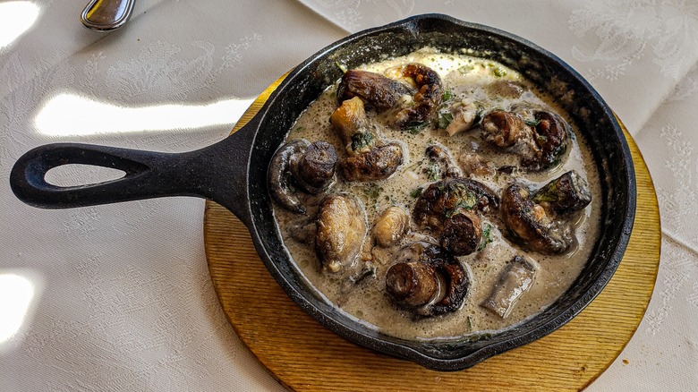 Mushrooms simmering in sauce