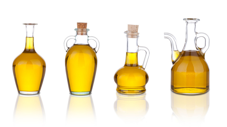 Four differently shaped bottles of cooking oil