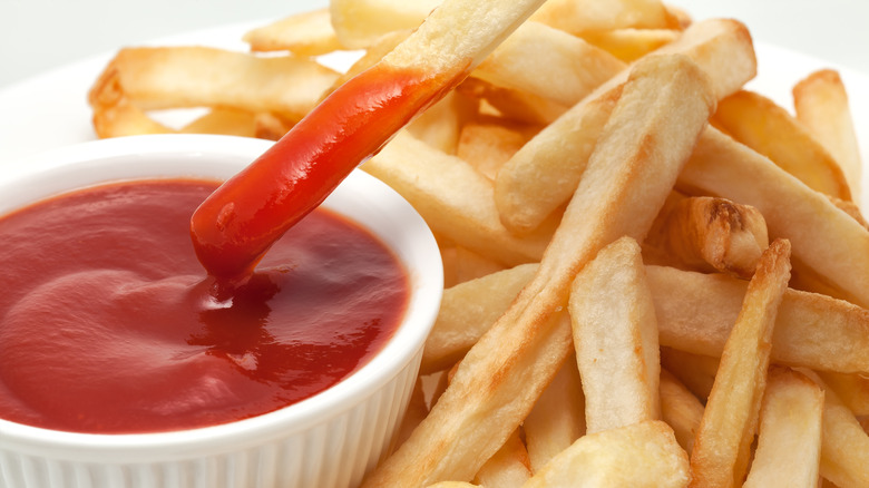 fries dipped in ketchup