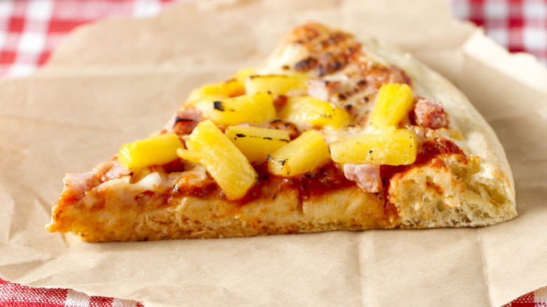 slice of ham and pineapple pizza