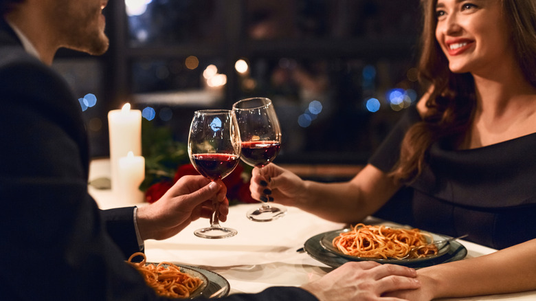 Couple having romantic dinner by candle light