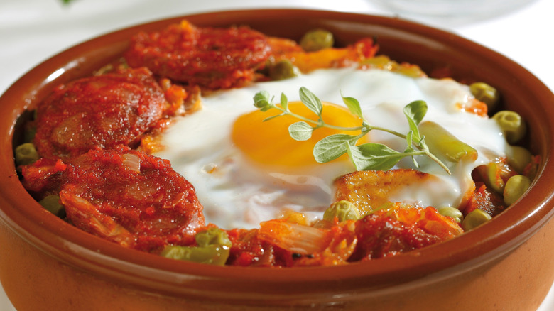 Huevos a la flamenca in a clay pot