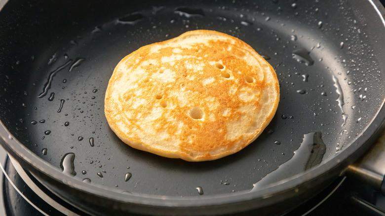 Pancake in oily pan