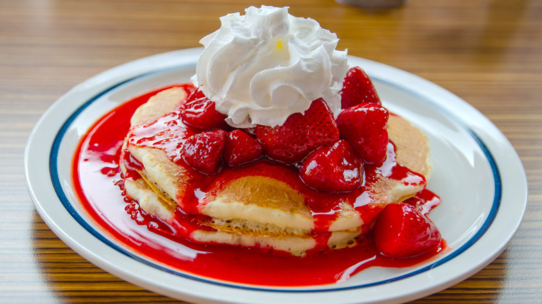 Pancakes, strawberries, whipped cream