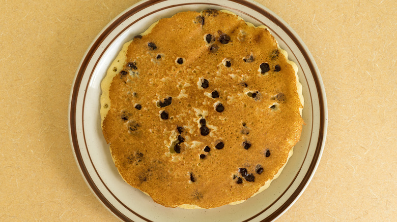 Chocolate chip pancake on plate