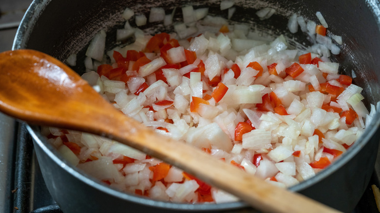 Pan with onions and peppers cooking