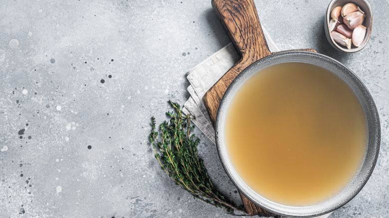 Small bowl of broth with seasonings