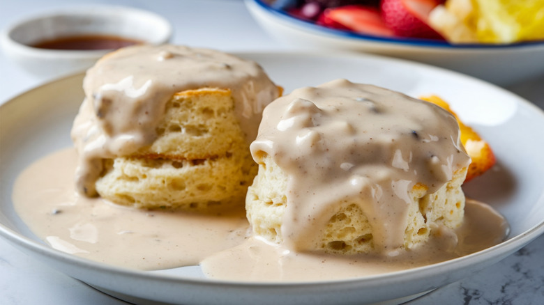 Plate of biscuits smothered in and sausage gravy