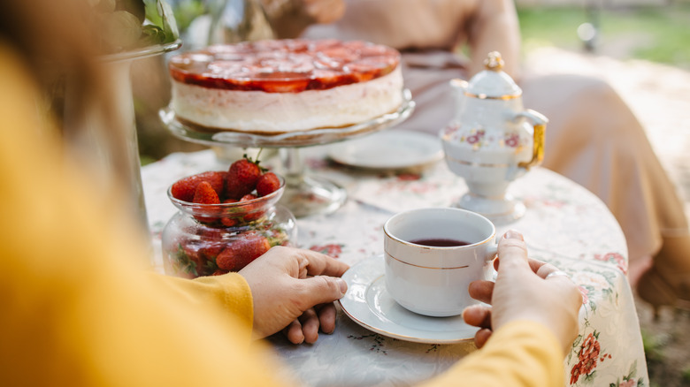 women in dresses at tea party