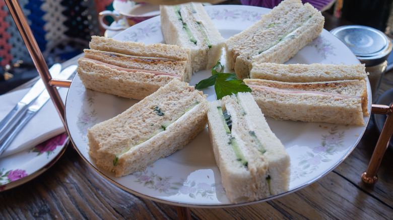 three-layered tea sandwiches on fancy plate