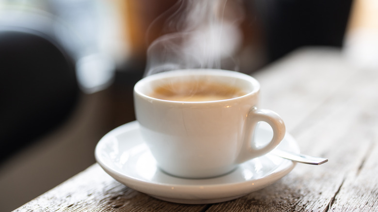 steaming hot cup of tea with milk