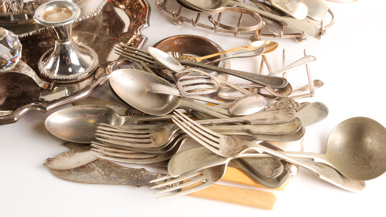 assortment of antique silverware