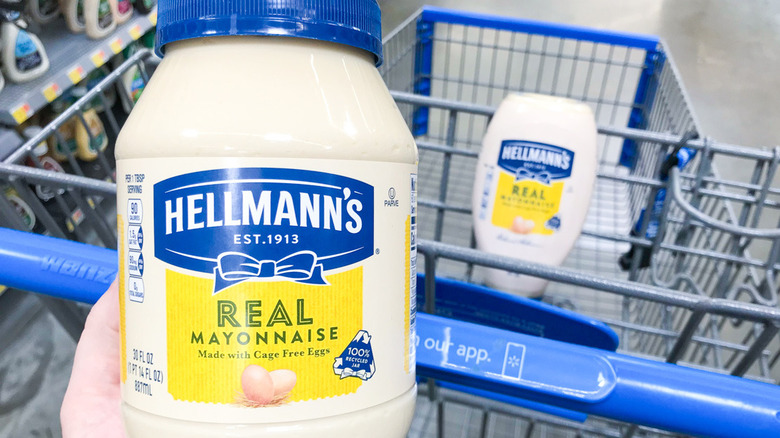 hand holding jar of mayonnaise