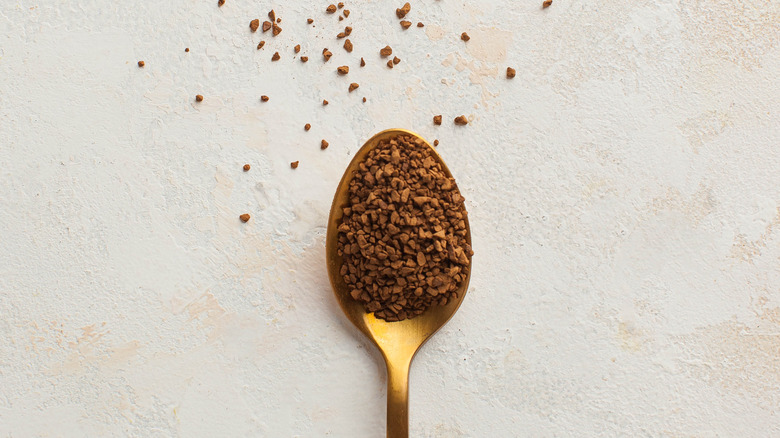 Instant espresso in golden spoon