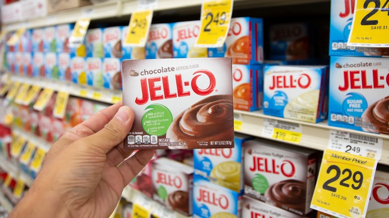 Hand holding Jell-O  in store