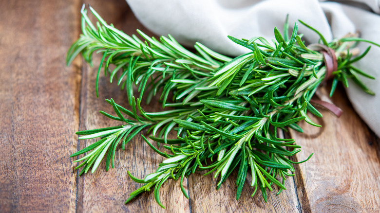 rosemary on wooden background
