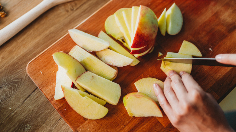 slicing apples on board