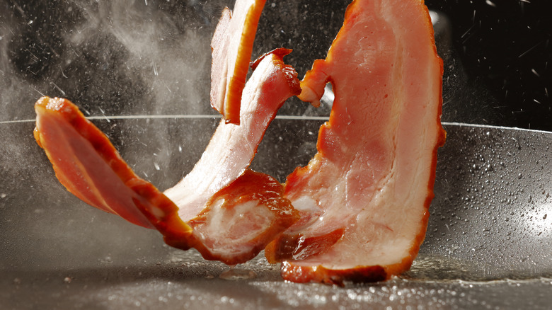 bacon hitting hot pan