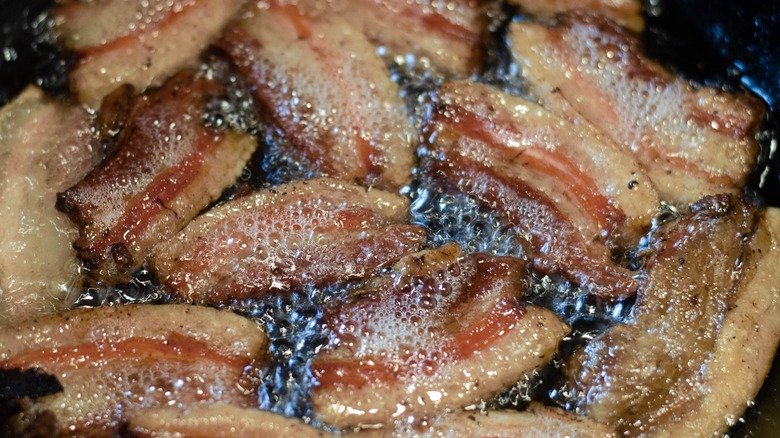 bacon frying in pan