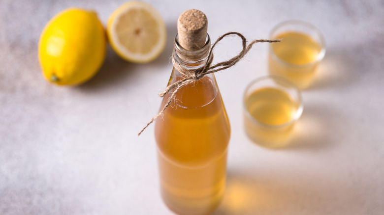 bottle of vinegar with lemons