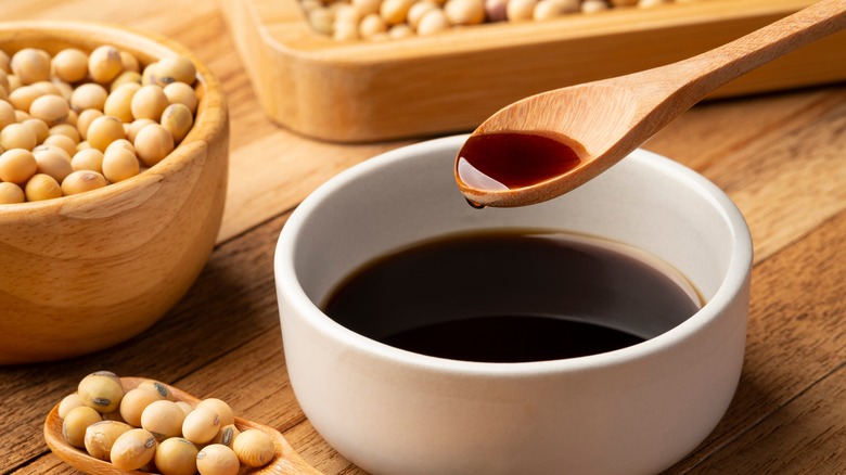 soy beans and bowl of soy sauce