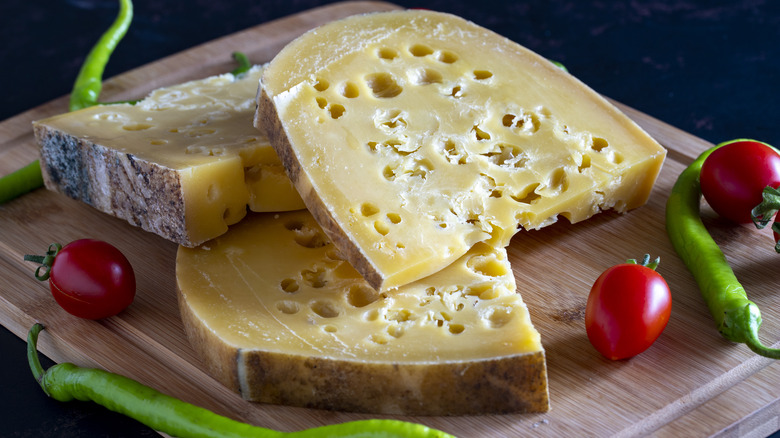 Gruyère cheese wedges on board