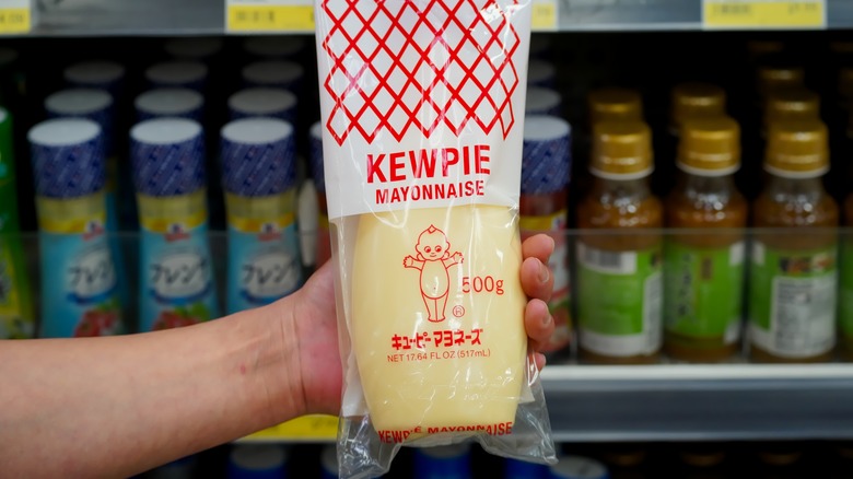 person holding kewpie mayonnaise bag