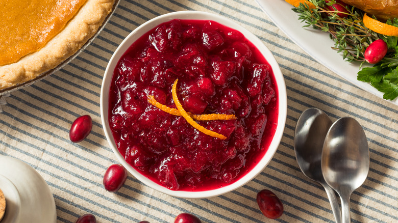 Bowl of cranberry sauce with two spoons