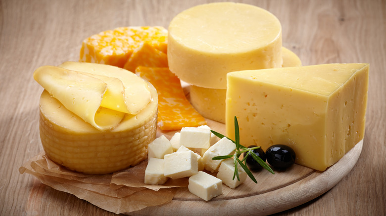 Assorted cheeses on board 