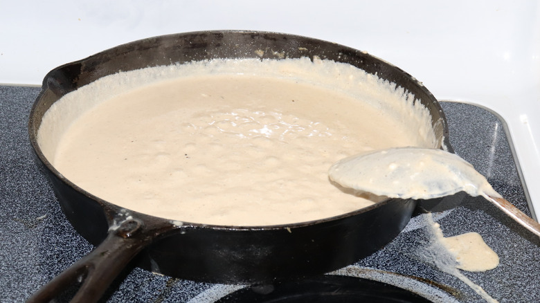 Frying pan of alfredo sauce