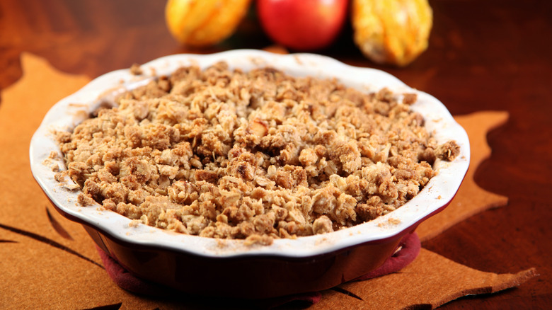 Fruit crumble in a red baking dish