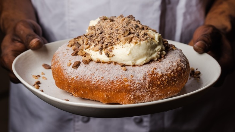 oversized doughnut with whipped cream