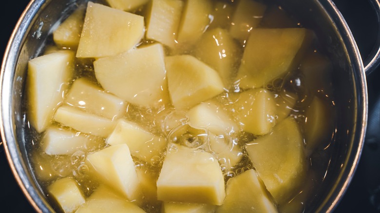 diced potatoes in boiling water