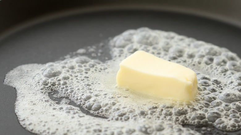butter melting in frying pan