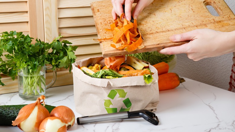 woman recycling vegetable scraps