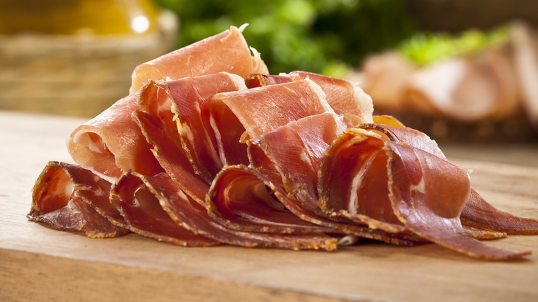 Slices of prosciutto on a cutting board