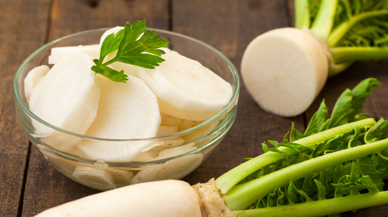 sliced daikon in glass bowl