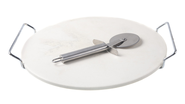white pizza stone and cutter