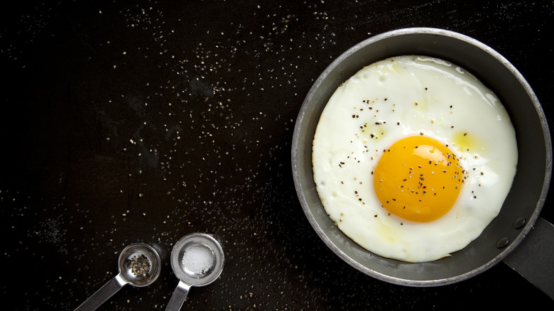 fried egg with salt and pepper