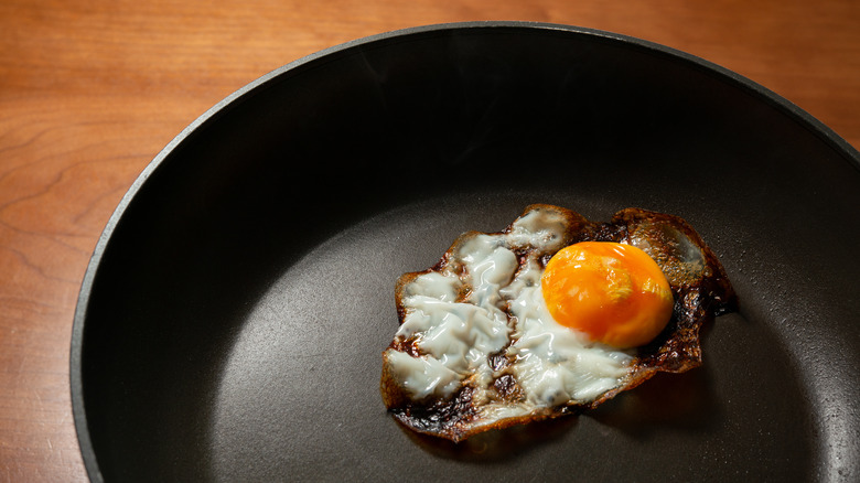 burned egg in frying pan