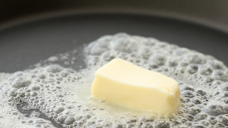 butter melting in a frying pan